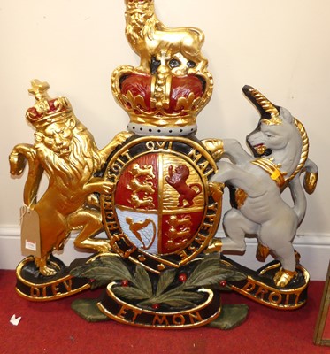 Lot 1196 - A painted and gilt resin coat of arms, 75 x 68....