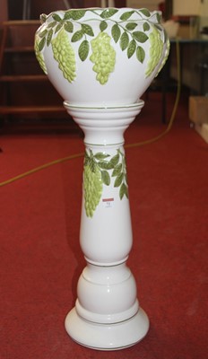 Lot 72 - A pottery jardiniere and stand relief...