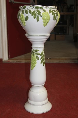 Lot 72 - A pottery jardiniere and stand relief...
