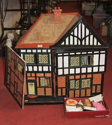 Lot 73 - A painted wooden dolls house together with a...