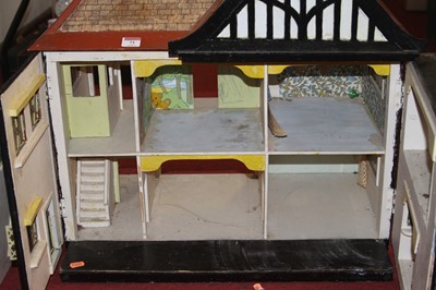 Lot 73 - A painted wooden dolls house together with a...