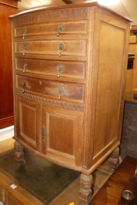 Lot 1215 - An early 20th century limed oak bowfront...