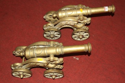 Lot 86 - A pair of cast brass models of cannons on...