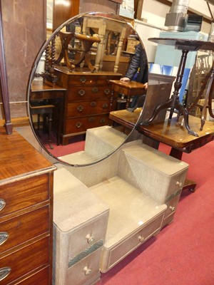 Lot 1246 - An Art Deco limed oak circular mirror back...