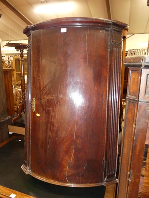 Lot 1271 - A 19th century mahogany bow front single door...