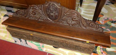 Lot 1308 - A floral relief carved oak wall shelf, length...