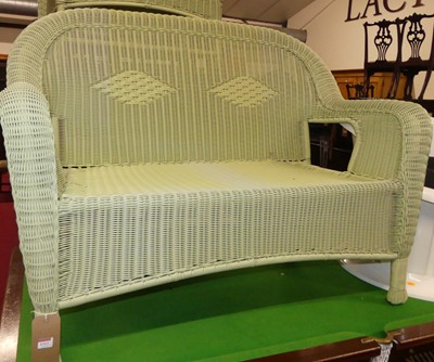 Lot 1312 - A contemporary faux wicker lime green coloured...