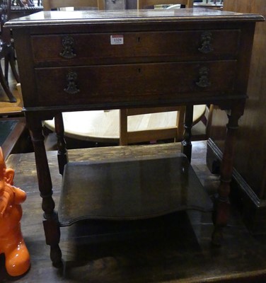 Lot 1329 - An early 20th century oak two drawer canteen...