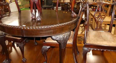 Lot 1338 - An early 20th century mahogany dining suite in...