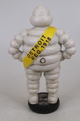 Lot 90 - A cast iron figure of the Michelin man, h.39cm