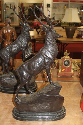 Lot 101 - A large pair of bronzed models of stags, each...