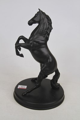 Lot 128 - A Royal Doulton model of a rearing horse...