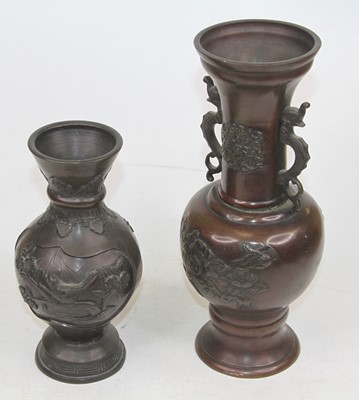 Lot 157 - A pair of Japanese bronzed vases, each relief...
