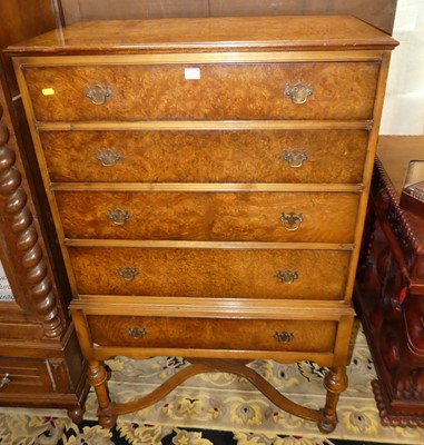 Lot 1405 - A 1930s figured walnut chest of five long...