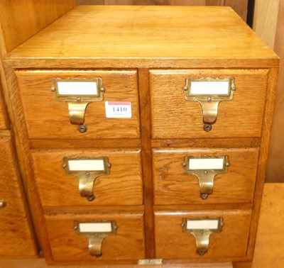 Lot 1410 - A 1930s oak table-top bank of six index filing...