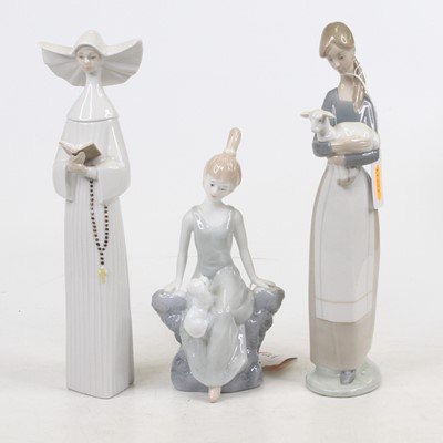 Lot 215 - Two Lladro porcelain figures of young ladies,...