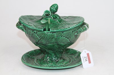 Lot 231 - A green glazed tureen, relief decorated with...