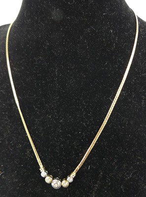 Lot 315 - A modern 9ct gold and diamond set necklet...