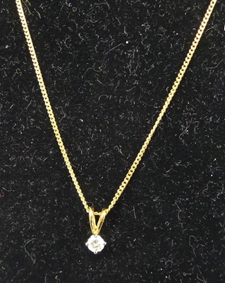 Lot 320 - An 18ct gold and diamond pendant, the four...