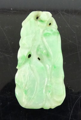 Lot 324 - A Chinese carved celadon and green jade...