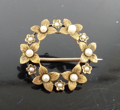 Lot 327 - A yellow metal and seed pearl set openwork...