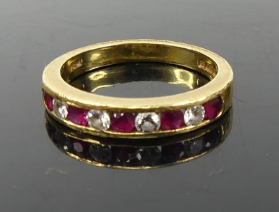 Lot 338 - A contemporary 18ct gold ruby and diamond set...