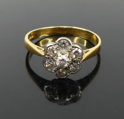 Lot 340 - An 18ct gold and diamond set flowerhead...