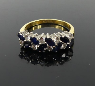 Lot 341 - An 18ct gold sapphire and diamond half hoop...