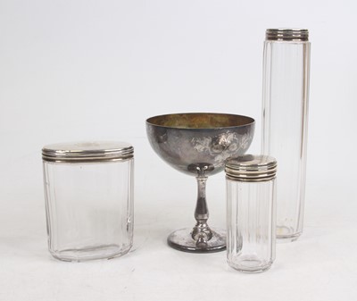 Lot 257 - A set of three Victorian silver topped glass...