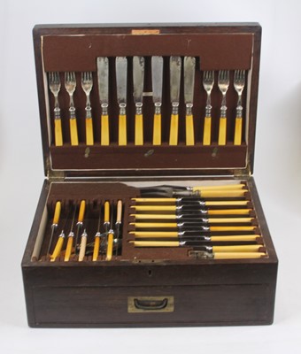 Lot 258 - An oak cased canteen of various silver plated...