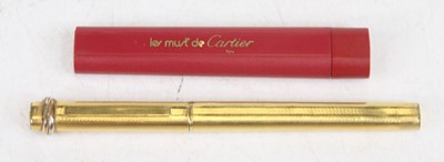 Lot 388 - A Must de Cartier gold plated cased ballpoint...