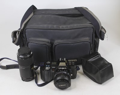 Lot 418 - A Minolta 35mm SLR camera, with bag, and...