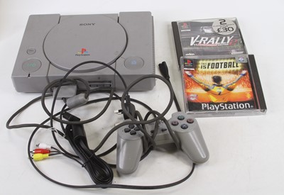 Lot 487 - A Sony Playstation with one controller and two...