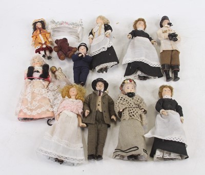 Lot 492 - A collection of miniature china dolls, with...