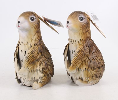 Lot 494 - A pair of painted metal seated rabbits, 21cm