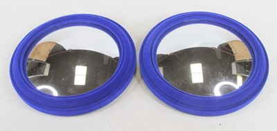 Lot 498 - A pair of small convex wall mirrors in blue...