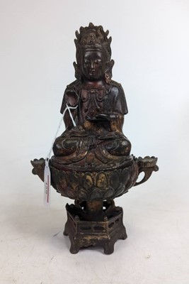 Lot 459 - A reproduction bronzed metal eastern deity,...