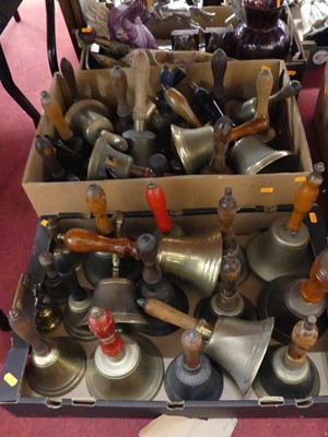 Lot 517 - Two boxes of various brass hand bells, largest...