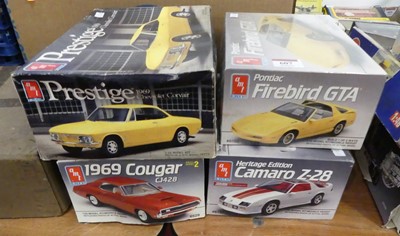 Lot 607 - A collection of four boxed AMT/ERTL 1/25 scale...