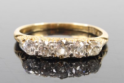 Lot 1290 - A yellow metal diamond five-stone ring,...