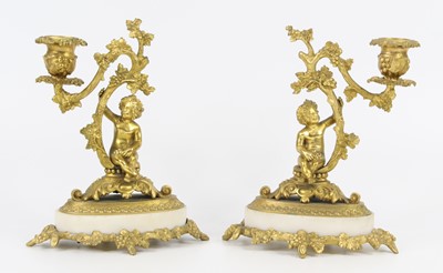 Lot 1373 - A pair of gilt metal cherub...