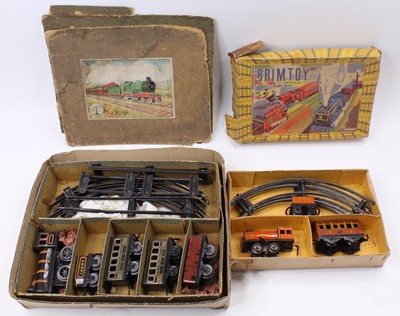 Lot 222 - Two Brimtoy train sets: LNWR  0-4-0 black...