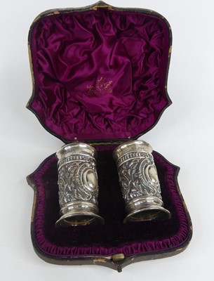 Lot 1172 - A cased pair of Victorian silver pepperettes,...
