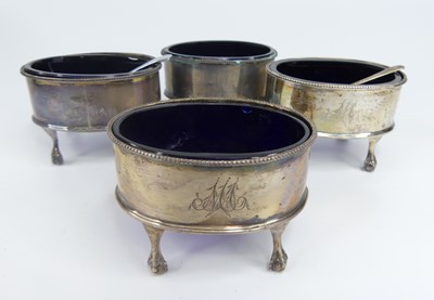 Lot 1146 - A set of four George III silver table salts,...