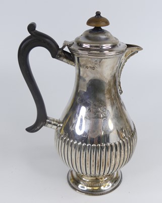 Lot 1175 - A Victorian silver hot water jug, of...