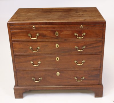 Lot - A George III mahogany bachelors chest the cross banded