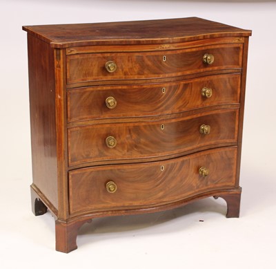 Lot 1570 - A George III mahogany chest of serpentine...