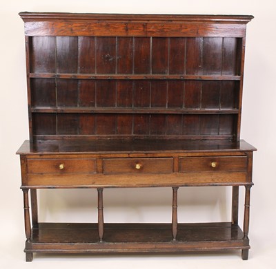 Lot 1563 - A mid 18th century joined oak dresser, the...