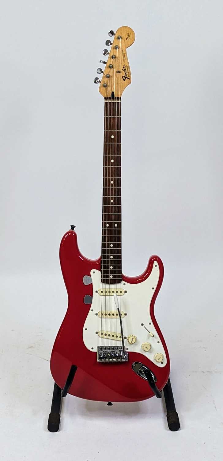 Lot 521 - A Squier by Fender stratocaster electric...