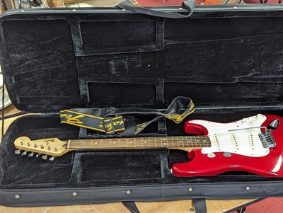 Lot 521 - A Squier by Fender stratocaster electric...